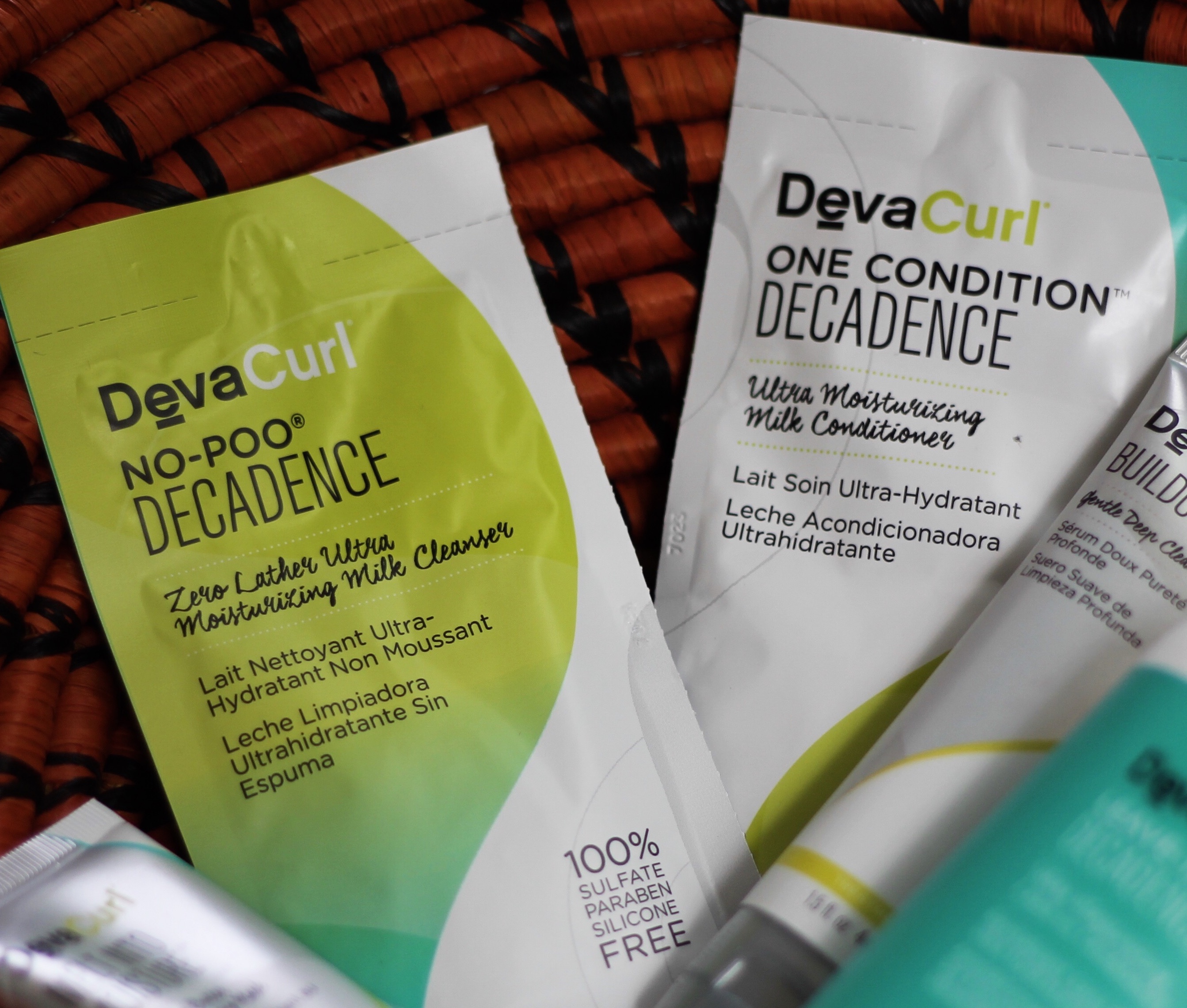 black kinky Coily hair blog, ugandan blogger, DEVACURL No-Poo® Decadence DEVACURL Buildup Buster™ Micellar Water Cleansing Serum DEVACURL Melt into Moisture Matcha Butter Conditioning Mask DEVACURL One Condition™ Decadence DEVACURL Leave-In Decadence™ Ultra Moisturizing Leave-In Conditioner