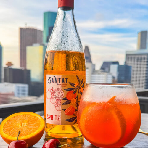 mocktail, non-alcoholic drink, summer mocktail, aperol spritz alternative, Santat Spritz, European summer drink, cherry mocktail, alcohol-free aperitif, Italian soda mocktail, Portofino-inspired drink, bitter orange mocktail, alcohol-free cocktail, Mediterranean mocktail, sober summer drink, elegant mocktail